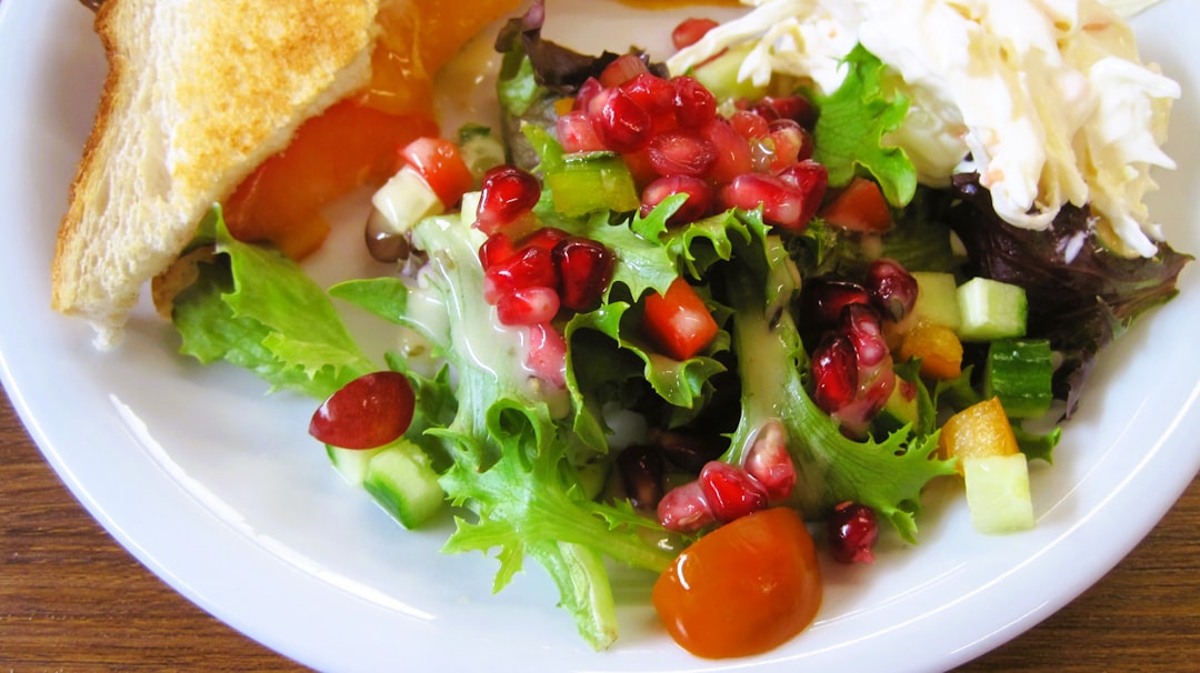 A delicious salad with pomegranate is shown.